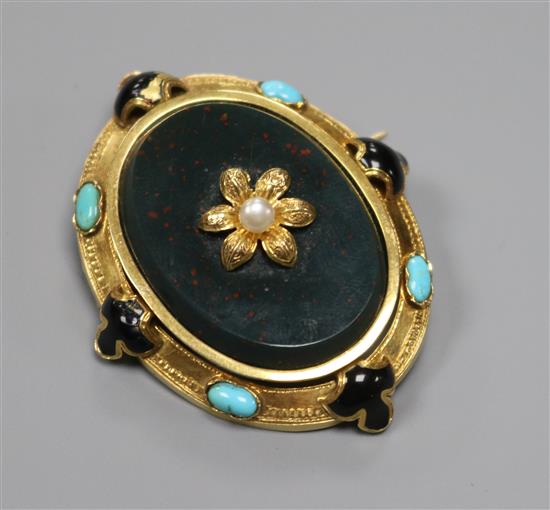 A late Victorian yellow metal, turquoise, black enamel and bloodstone set oval brooch, 47mm.